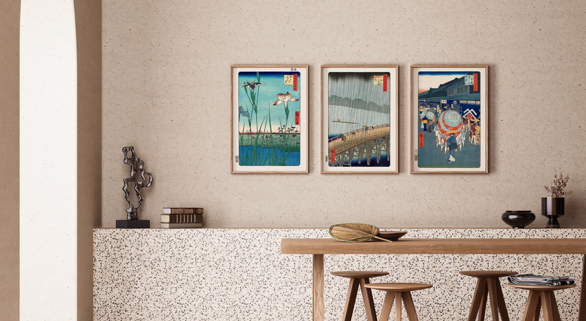 Three framed Japanese art pieces by Utagawa Hiroshige displayed on a wall