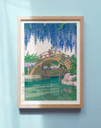 Framed Kawase Hasui's Japanese Art Poster: Wisteria in full bloom in a serene Japanese garden